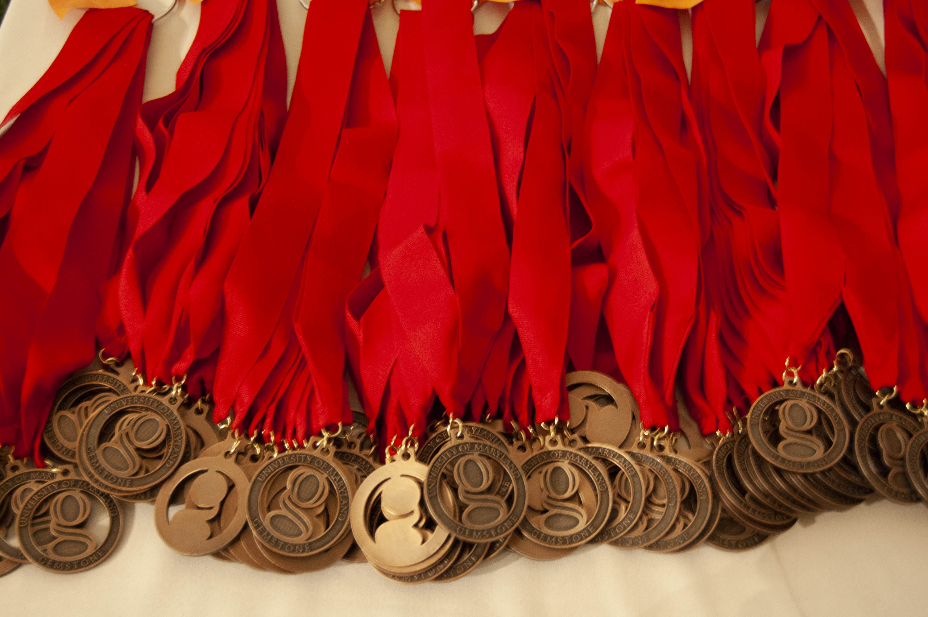 display of gemstone awards on ribbons