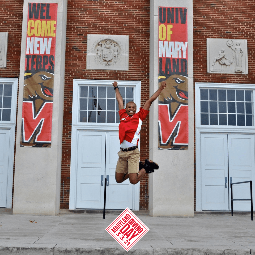 man jumping in front of building