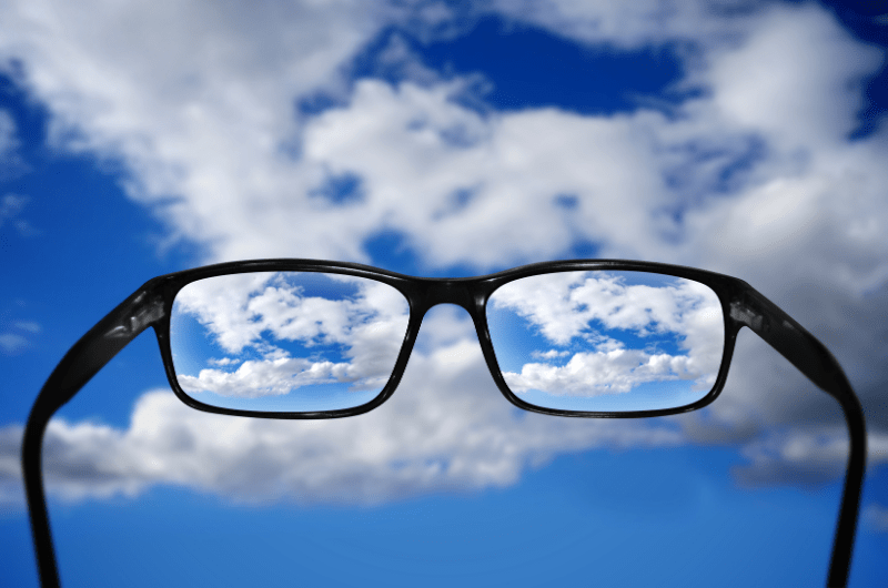 glasses held up to sky