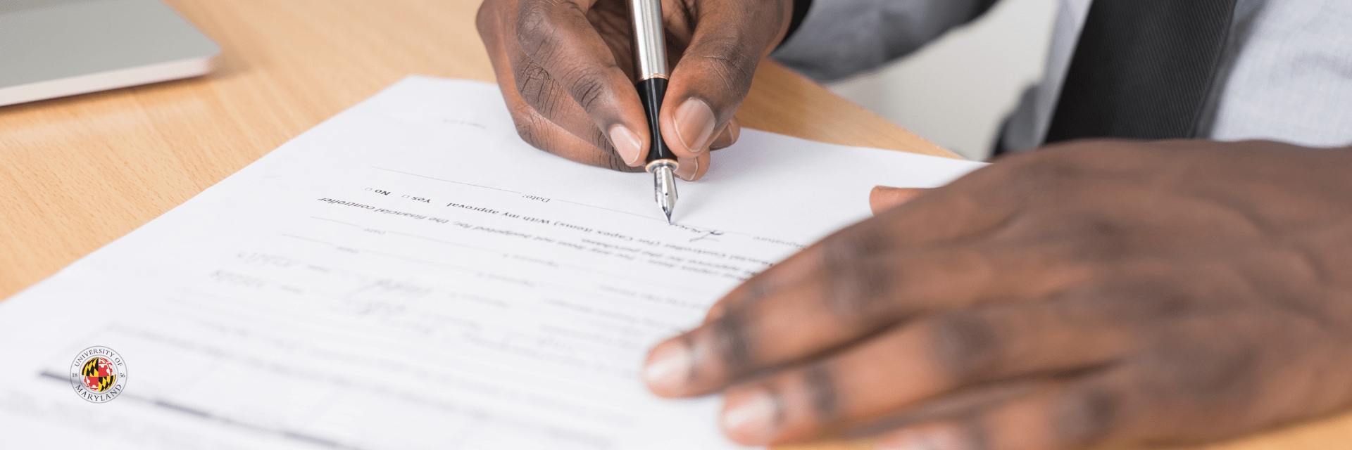 hands visible, holding pen and paper