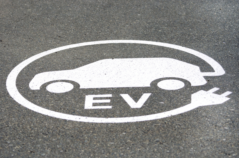 ev sign on pavement