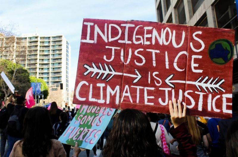 poster at protest: indigenous justice is climate justice