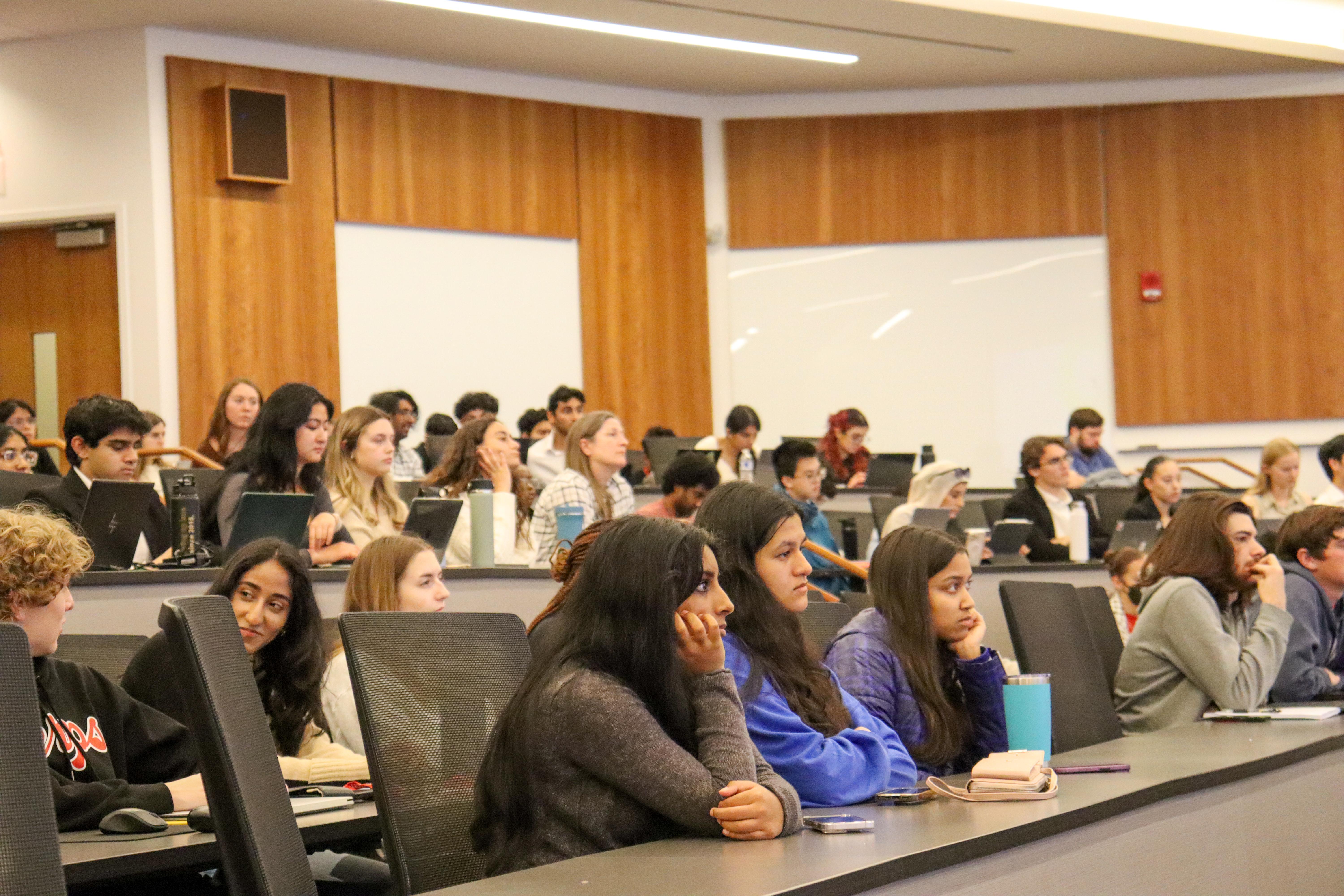 Students sitting down in lecture hall