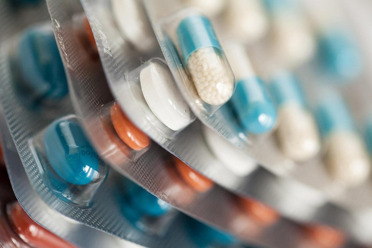 Side view of a stack of blister packs full of pills