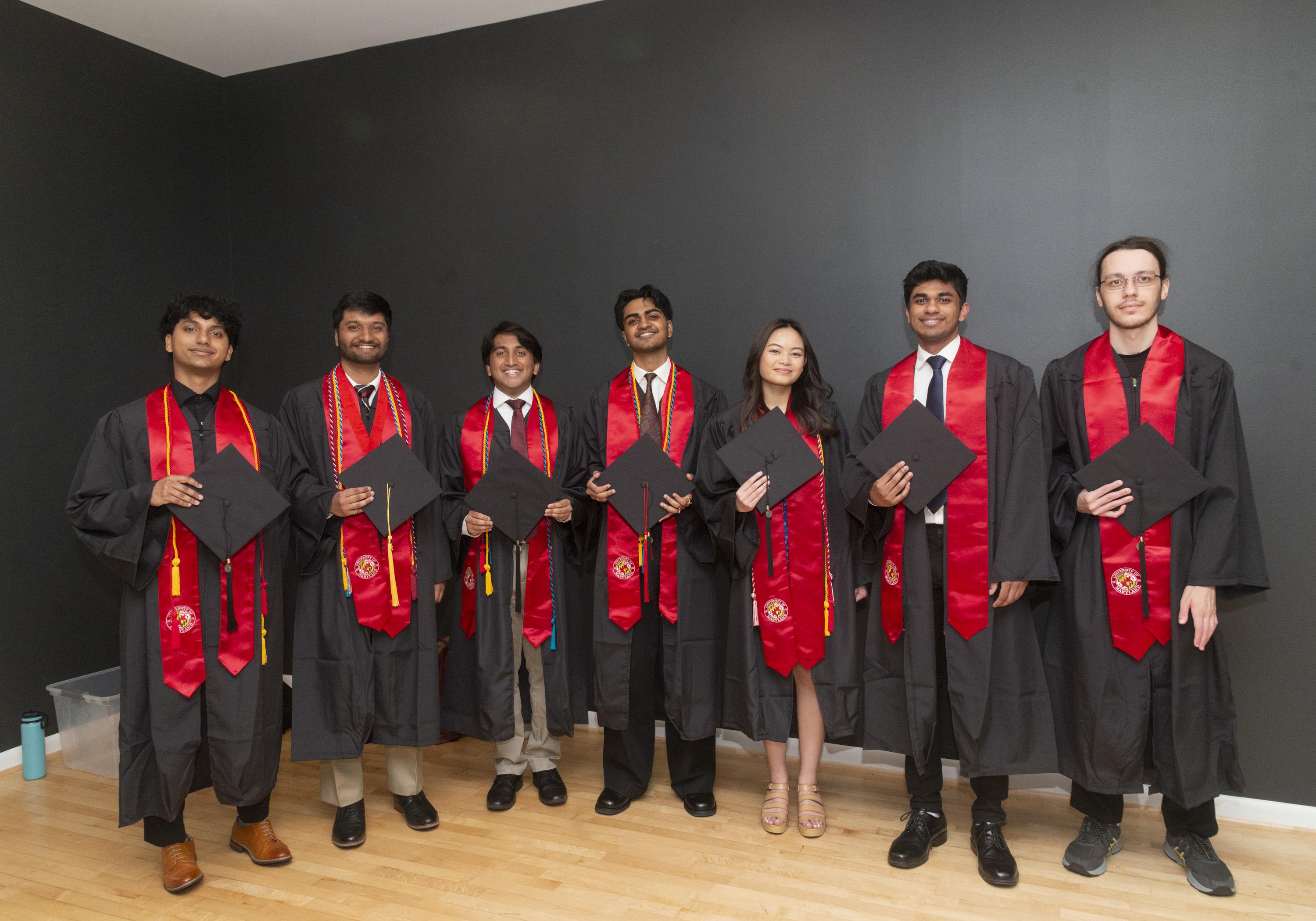 Seven Gemstone students wearing graduation caps and gowns