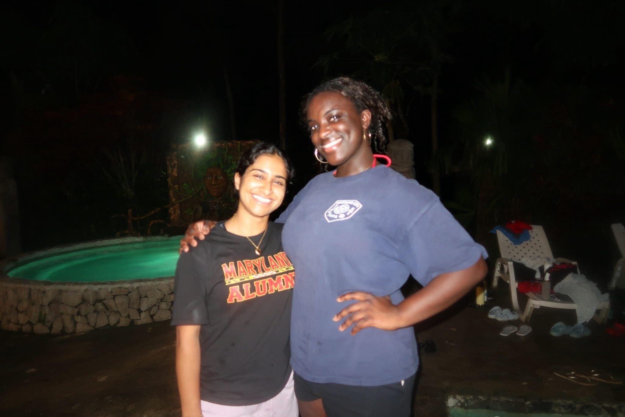 Tami Mumuney posing and smiling for photo with Annette Eldo, Gemstone alumna