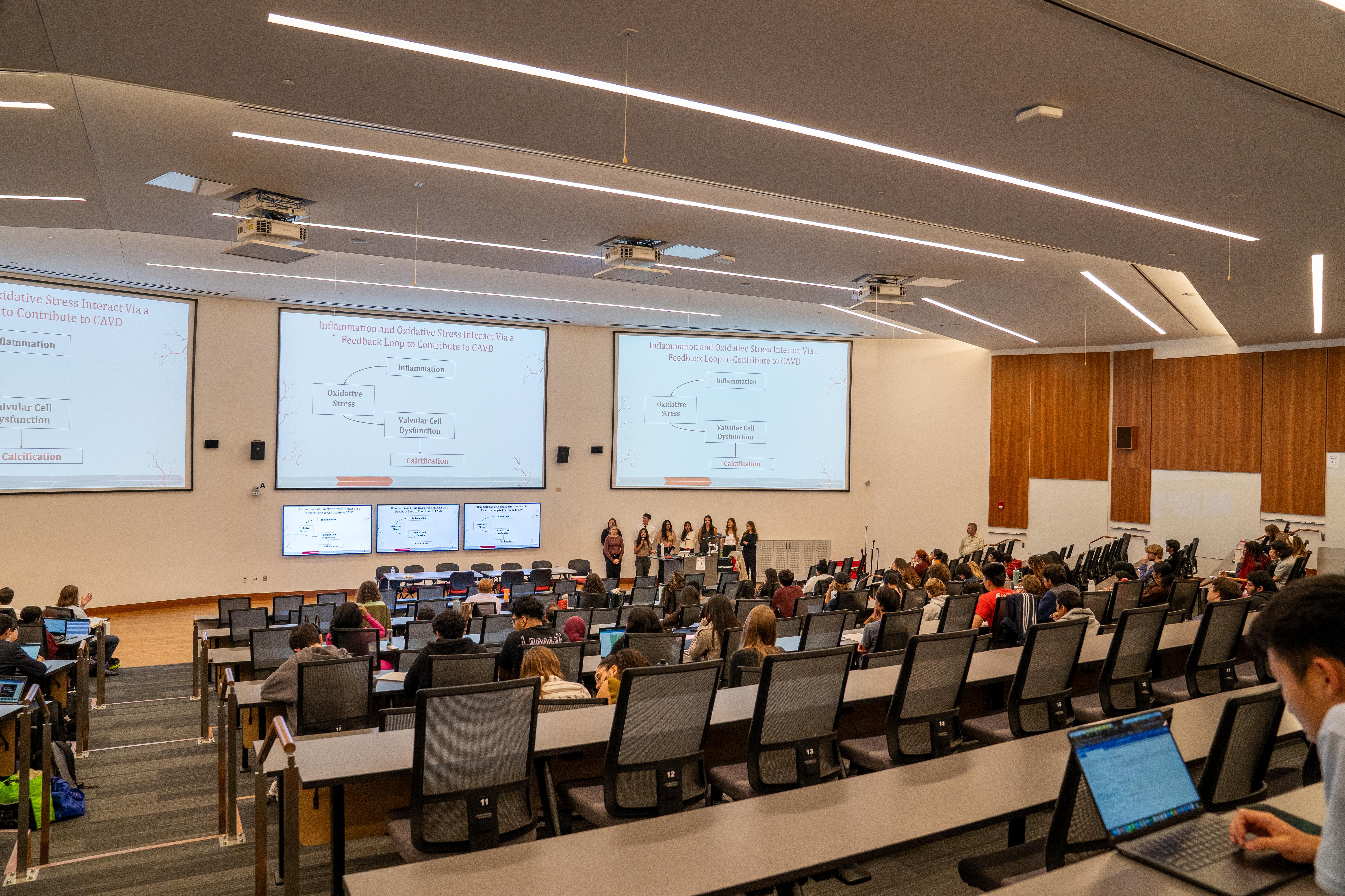 Gemstone students in lecture hall watching a presentation