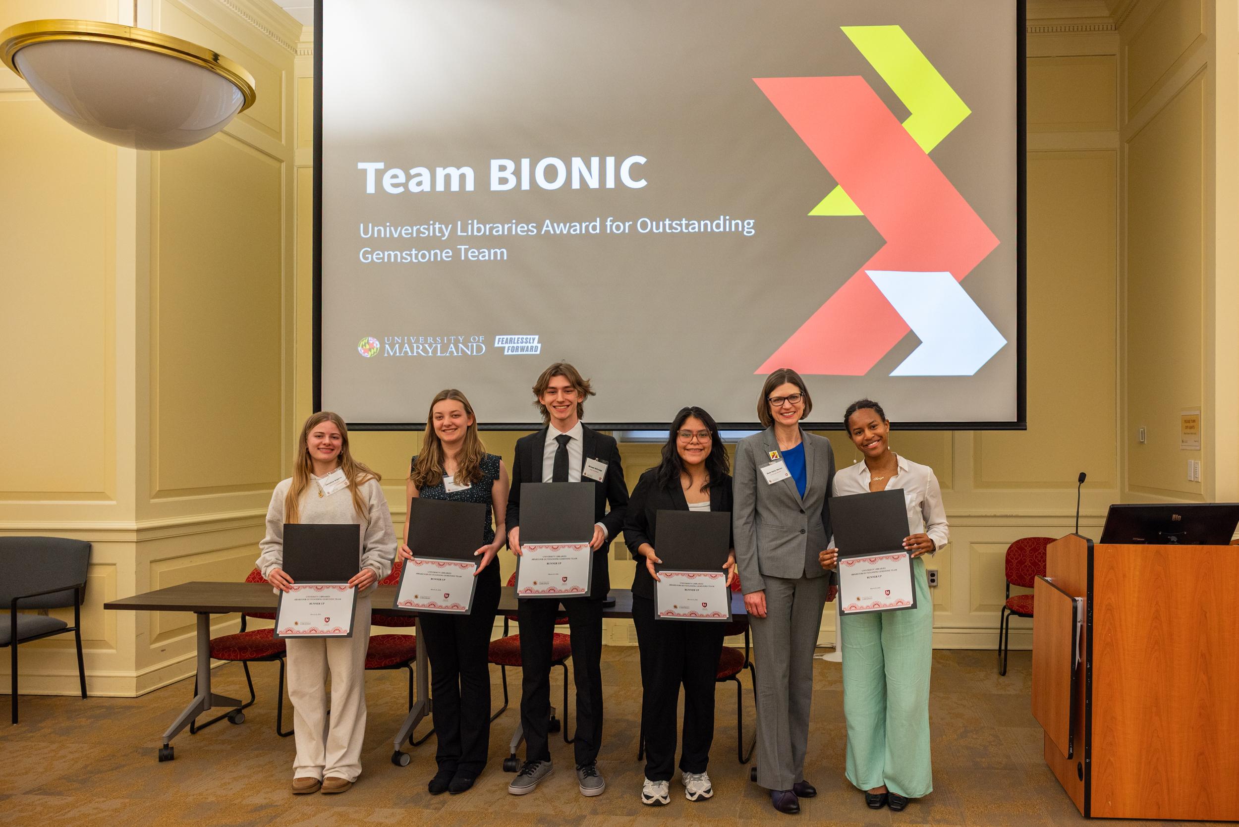 Team BIONIC with their award certificates
